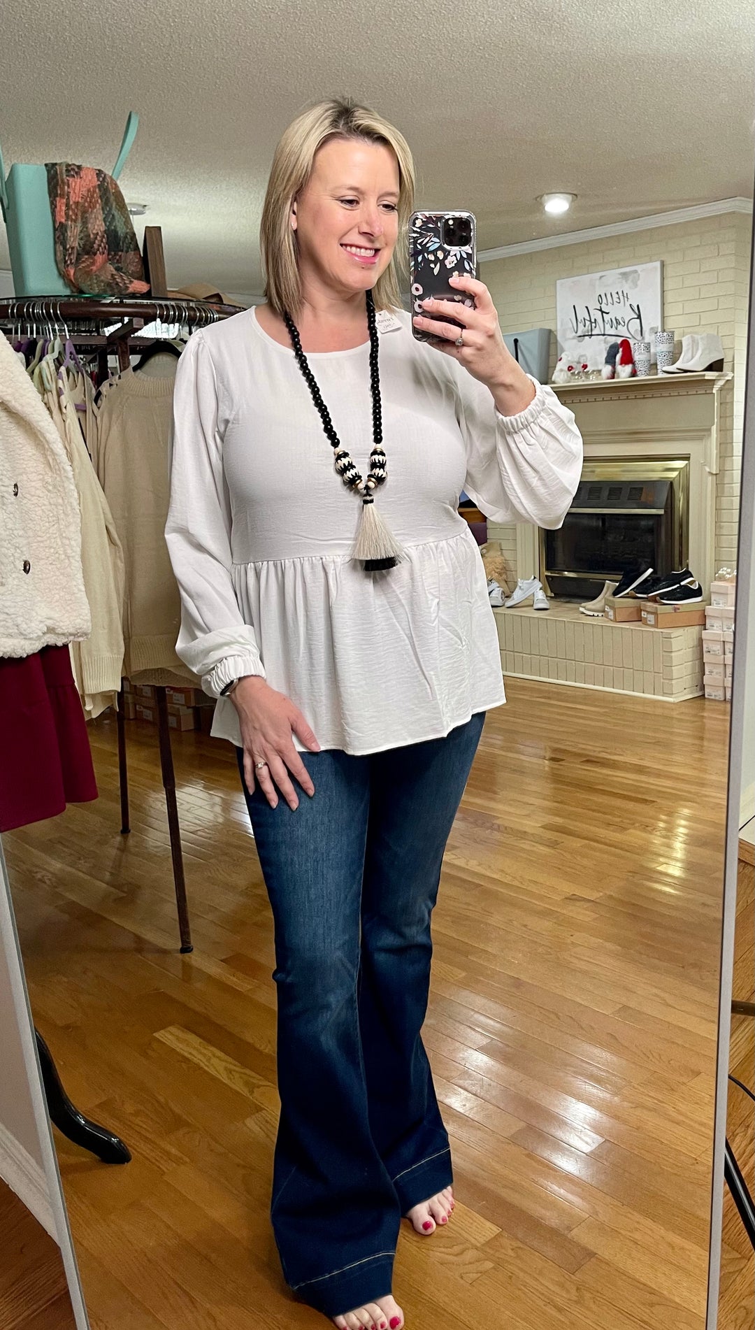 Ivory Long sleeve ruffle hem top