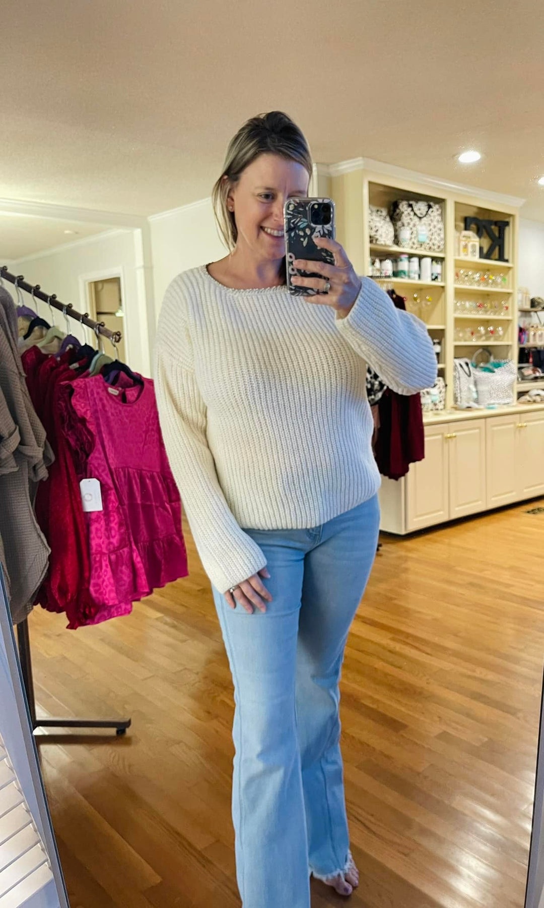 Off white sweater with silver trimmed neckline