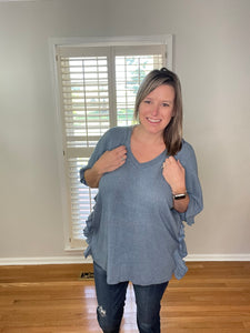 Ribbed poncho style top with ruffle side